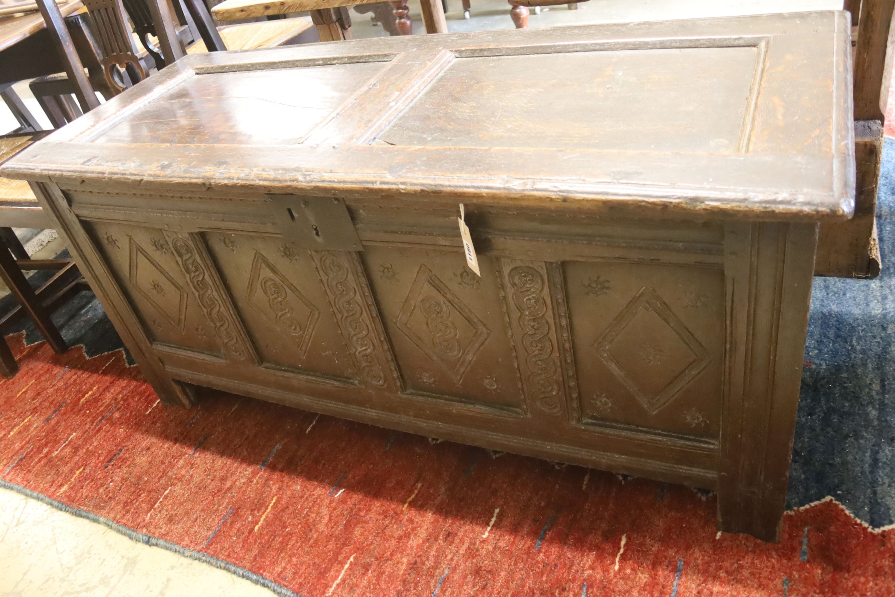 A 17th century oak panelled coffer, length 130cm, depth 53cm, height 60cm